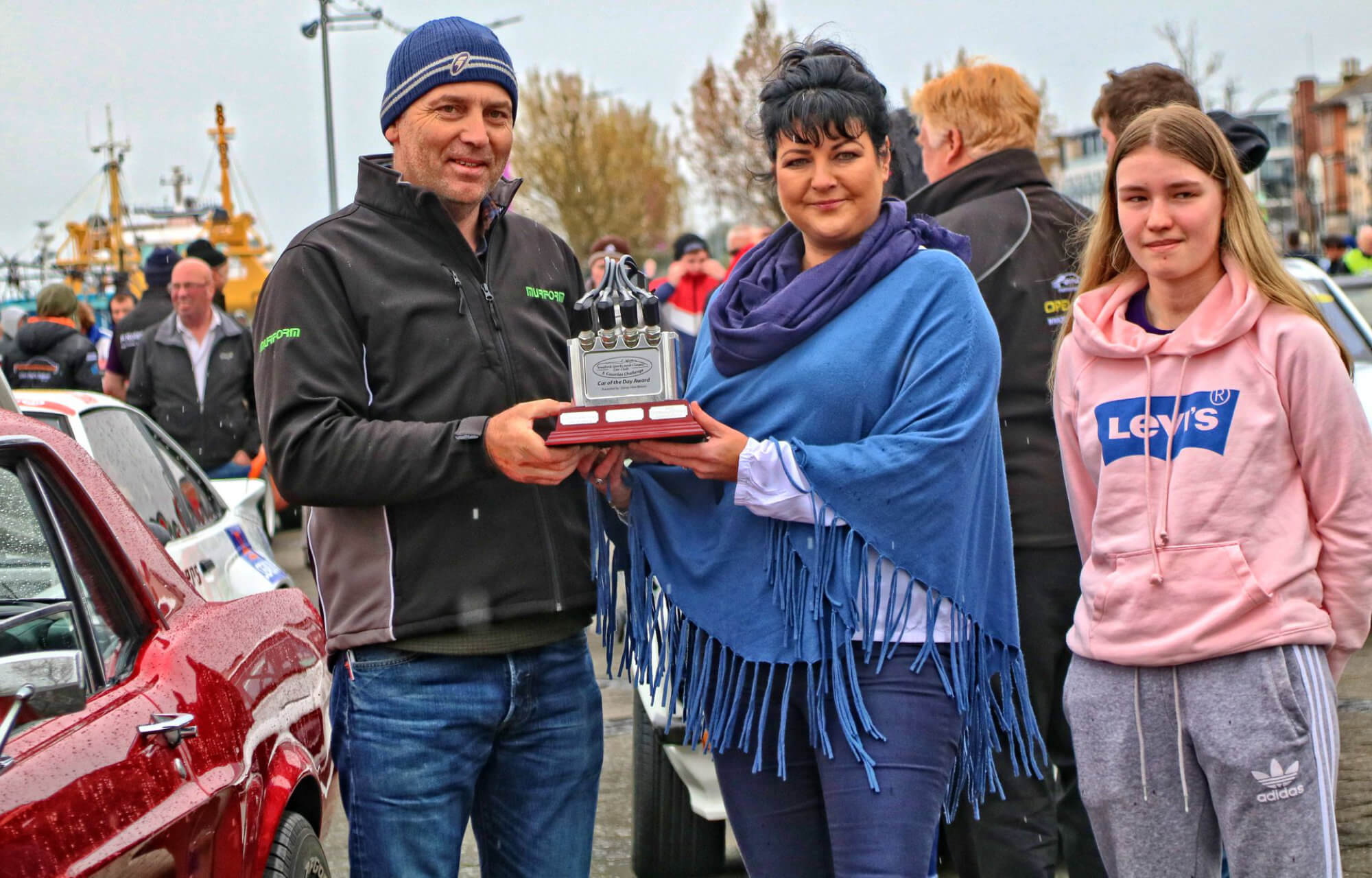 Margo presenting the Slaney View Honda Perpetual Trophy to Larry Murphy and his daughter Lara